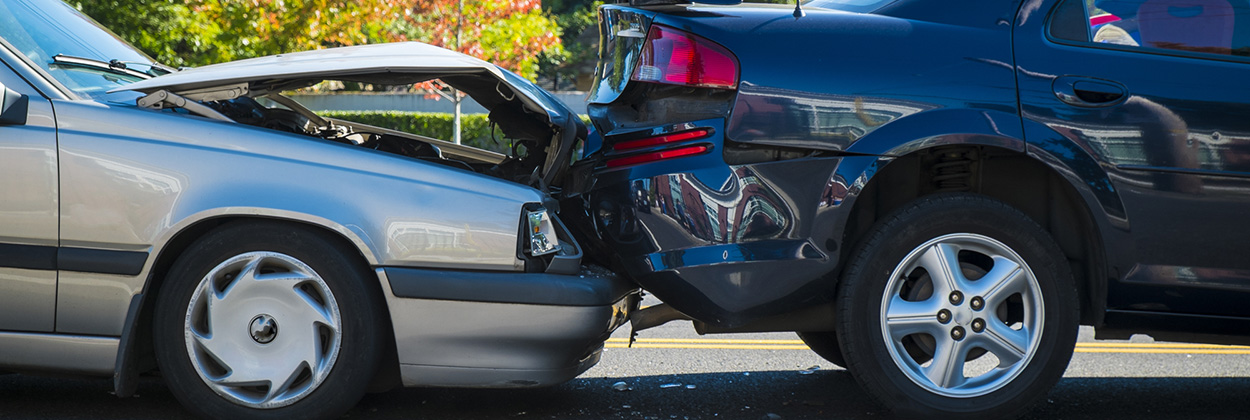 Auto accident involving two cars Two cars involved in a rear-end collision on a roadway in Arlington, VA.
